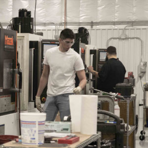 AGM machinists working in their new machine cells.